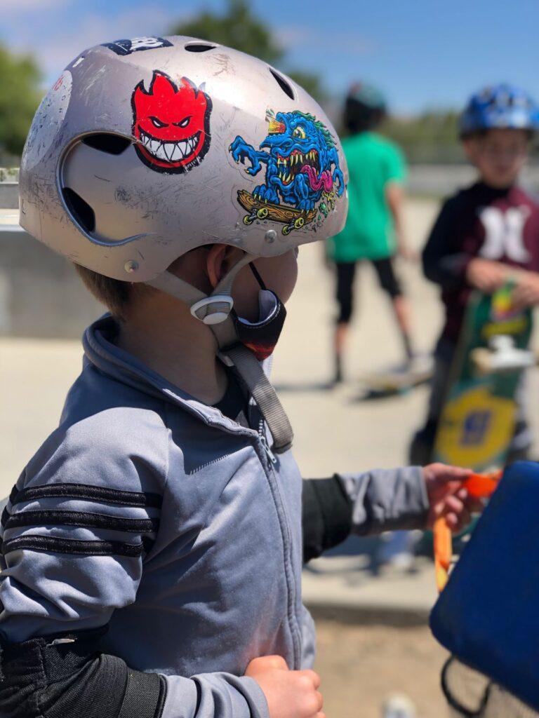 Kid using a helmet at Rob Skate academy